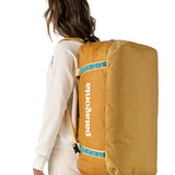Black Hole Duffel 70L - Pufferfish Gold