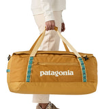 Black Hole Duffel 70L - Pufferfish Gold